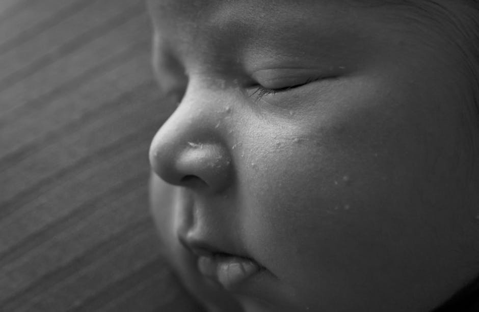 Close-up of a sleeping newborn baby, peaceful expression